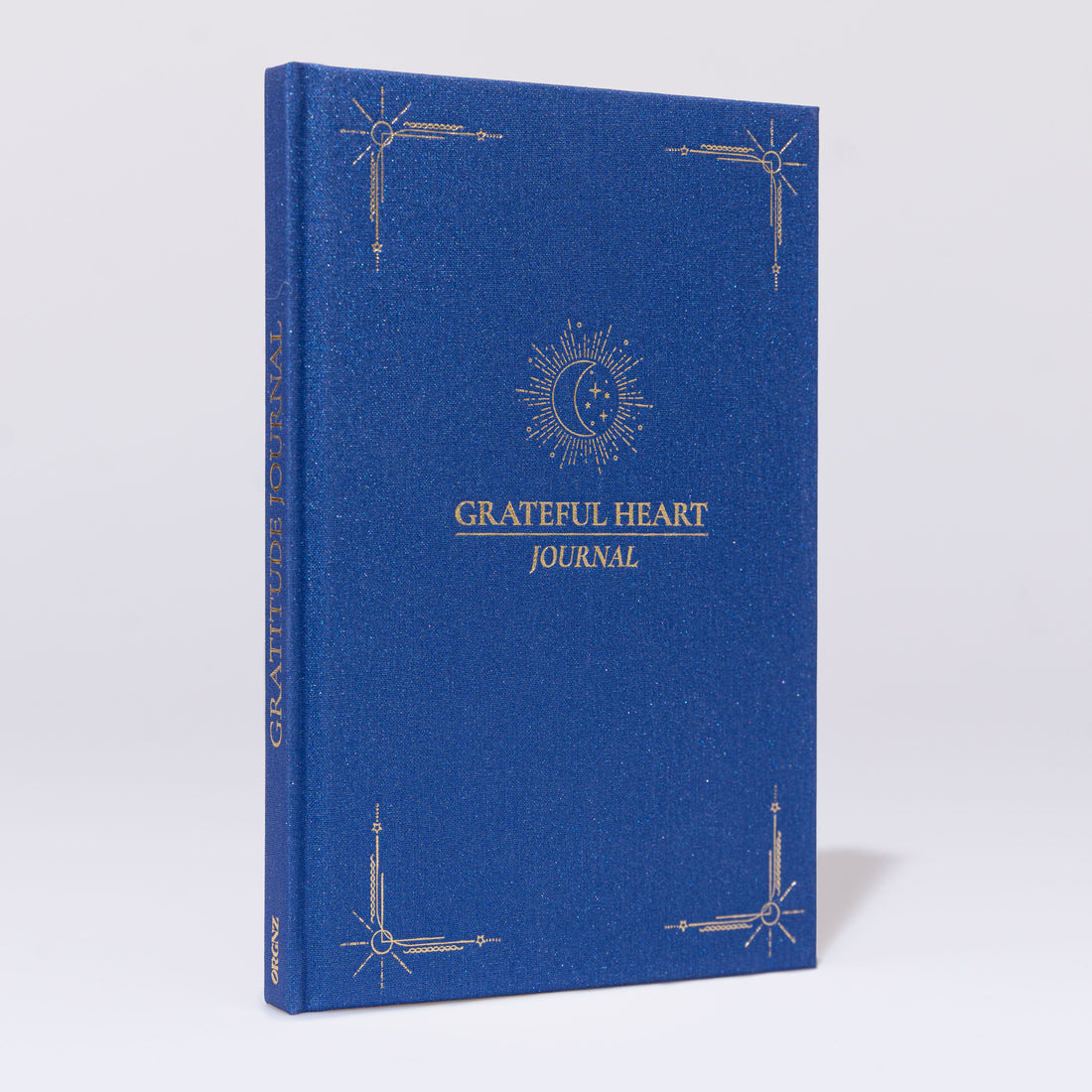 Gratitude Journal A5 Royal Frontansicht mit schimmerndem Stoffeinband und Goldprägung